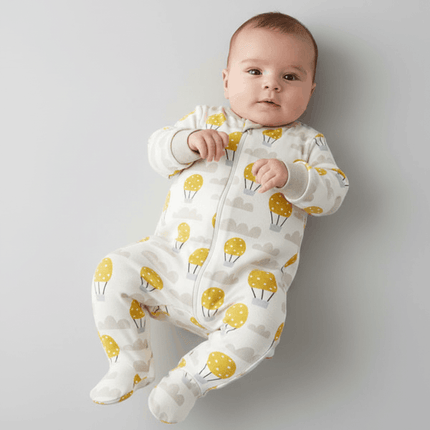 baby wearing long romper with airballoon print