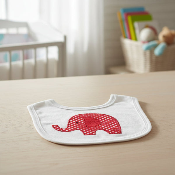 Red elephant bib on a table
