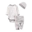 Baby outfit set with bodysuit, pants, and hat on a white background