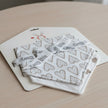 Cotton Bandana Hearts Baby Bib in card packaging on a table
