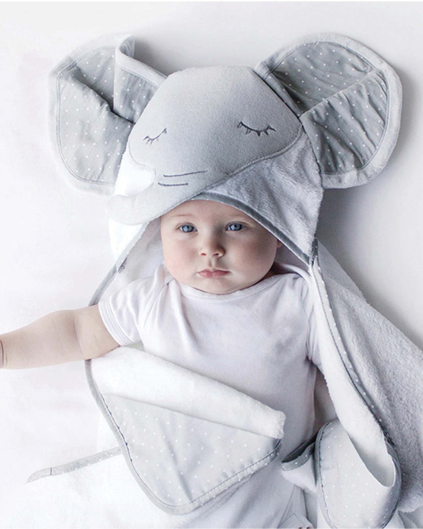 Baby wearing a grey elephant hooded towel by Bubba blue