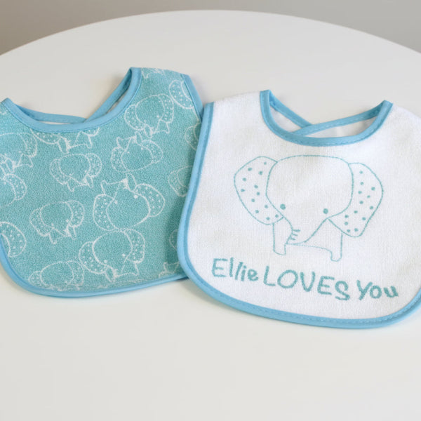Baby bib with 'Ellee LOVES YOU' text on a white background
