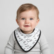 Baby bib with geometric pattern on a baby