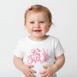 White kids top with 'Big Sister' and pink floral design on a white background