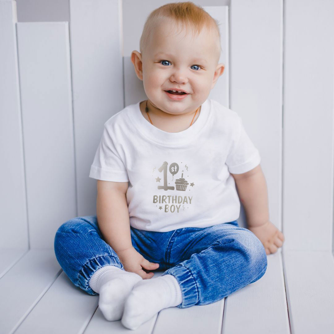 baby wearing 1st birthday boy top on his first birthday