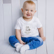 baby wearing 1st birthday boy top on his first birthday