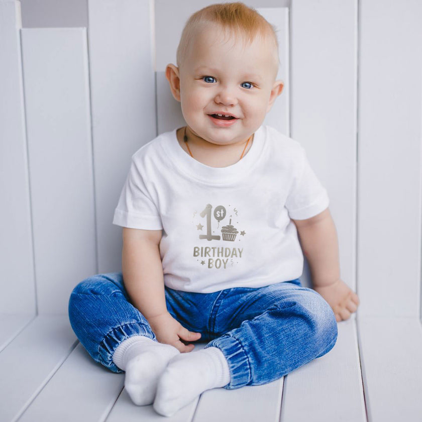 baby wearing 1st birthday boy top on his first birthday