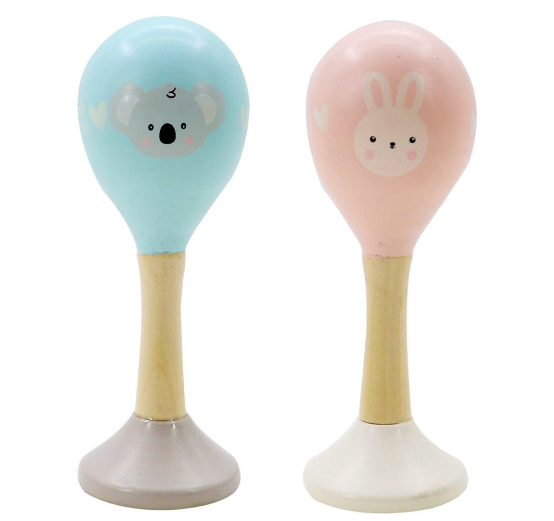 Two maracas with animal designs on a white background