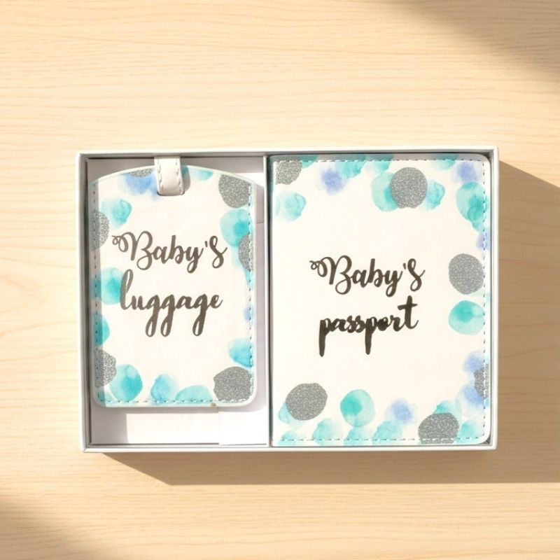 baby boy passport cover set on wooden table