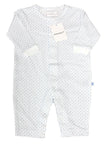 White baby romper with blue spots on a white background
