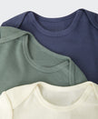 Close up of baby clothing on a white background