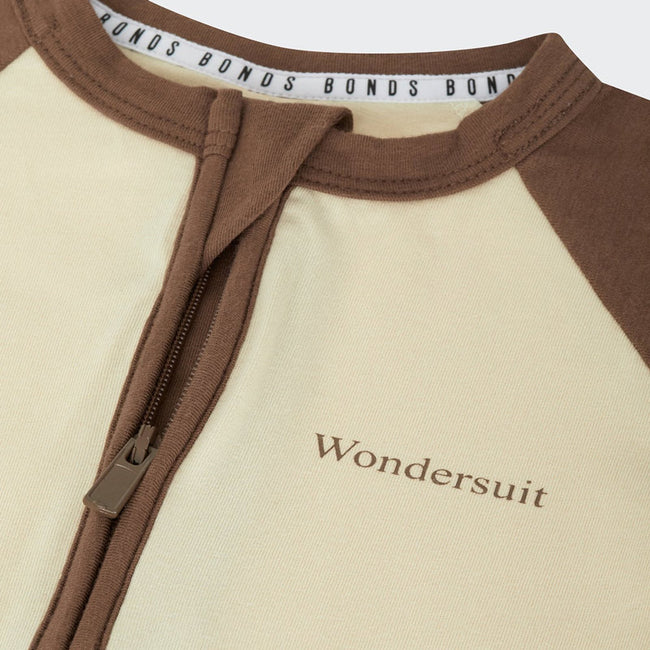 Bonds ivory and brown baby Zip Wondersuit on a white background