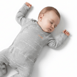 sleeping baby wearing bonds grey suit