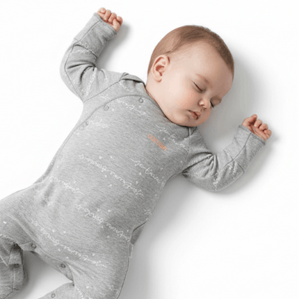 sleeping baby wearing bonds grey suit