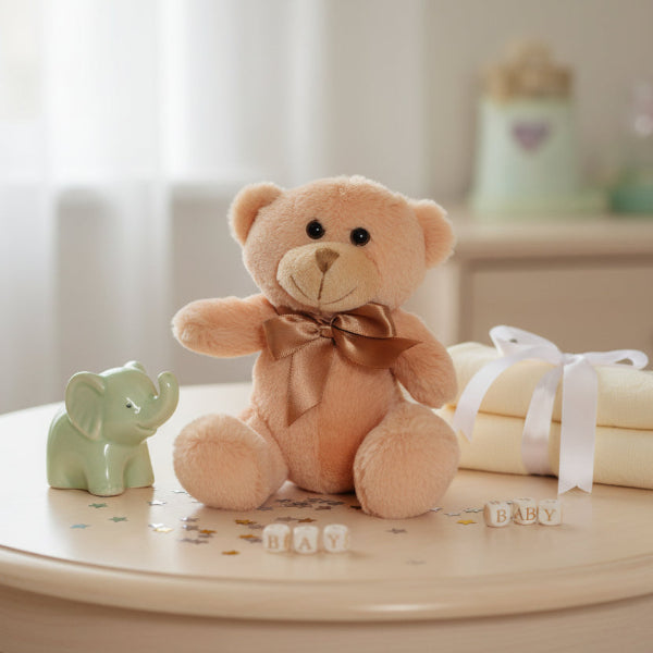 Beige teddy bear with a brown satin bow on a table