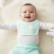 baby wearing green and white bunny set