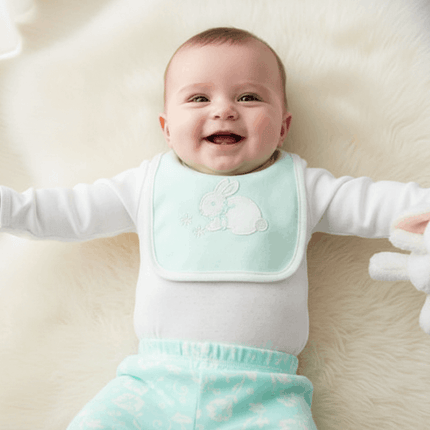 baby wearing green and white bunny set