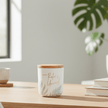 Relax and Unwind Sentiment Candle on desk