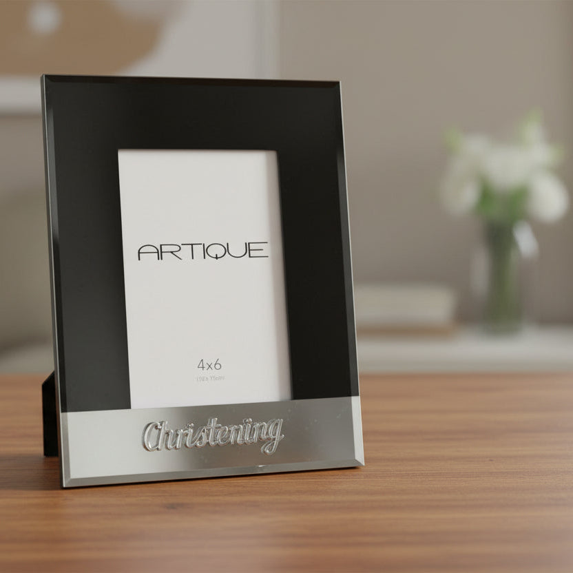 Black and silver photo frame with 'Artique' branding and 'Christening' engraving.