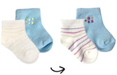 Set of baby socks in blue and white with floral designs on a white background