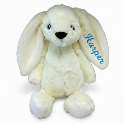 Cream bunny toy with name Adam embroidered on ear on a white background