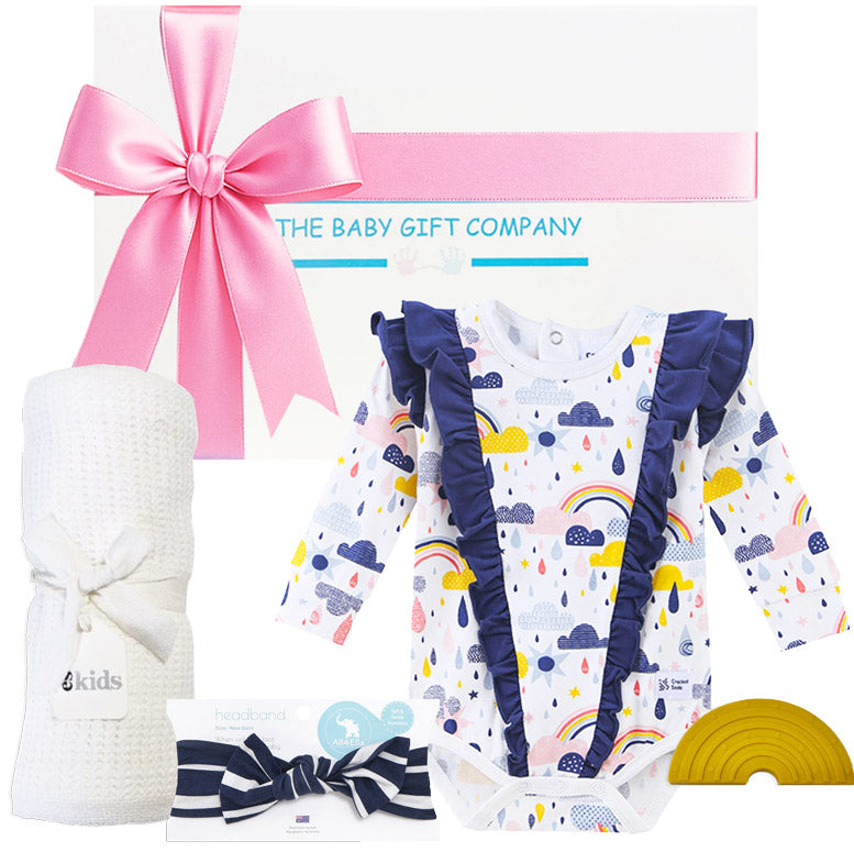 white knit blanket, baby girl frill romper and accessories with a white gift box from The baby gift company