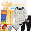 Baby gift set with onesie, hat, and items from The Baby Gift Company