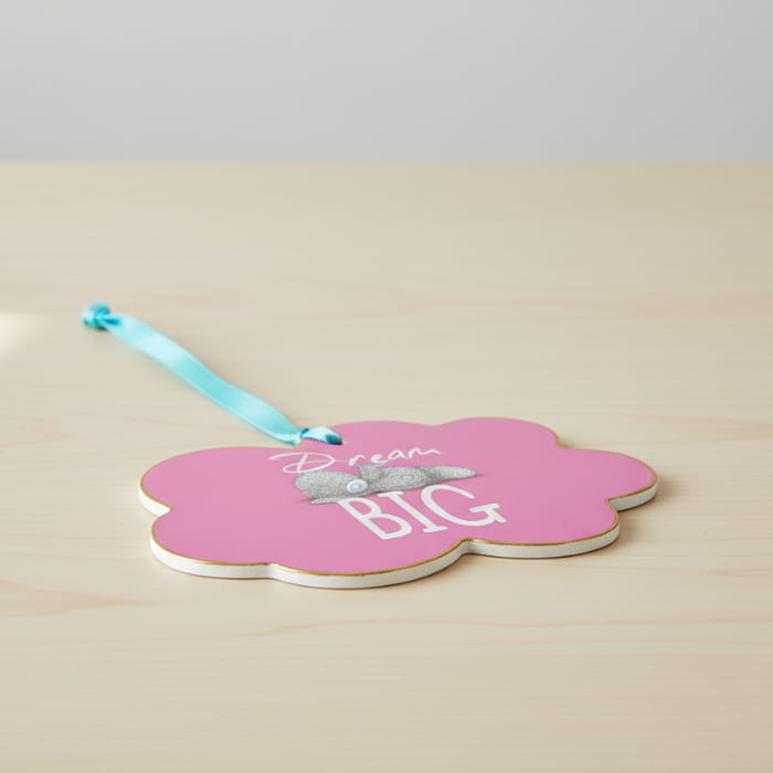 pink wooden dream big sign on table