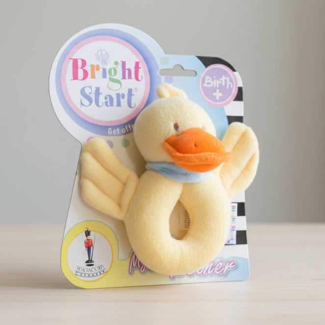 Plush duck toy with packaging labeled 'Bright Start' on a white background