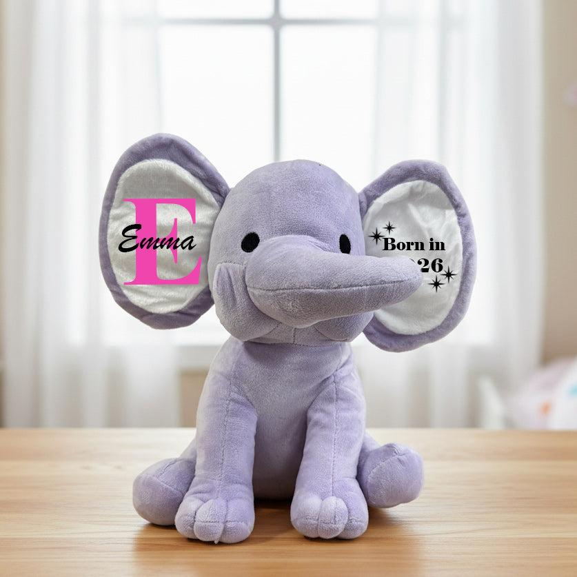 plush purple elephant with big ears on table