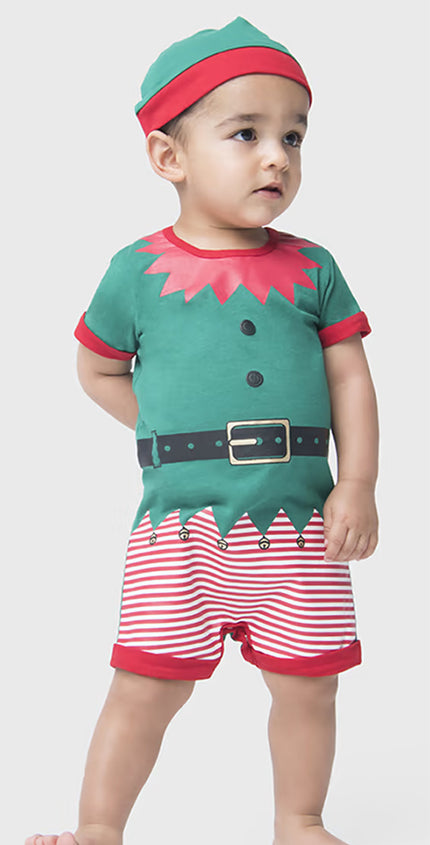 Child wearing a green elf costume with red and white striped shorts on a plain background