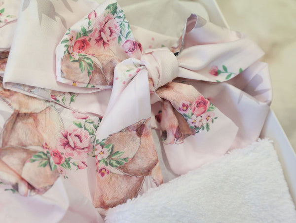 Floral fabric with pink and green flowers on a white background