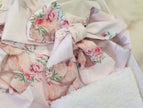 Floral fabric with pink and green flowers on a white background