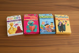 Set of Sesame Street flash card packs on a table background