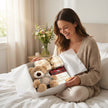 Mum holding gift box with teddy and biscuits