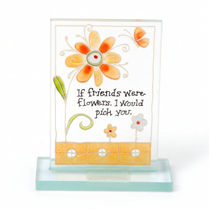Decorative glass plaque with flowers and a quote on a white background