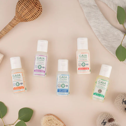 GAIA natural body care products on a neutral background with greenery