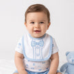 White and blue gentleman baby boy top and bib with bow tie on a cild