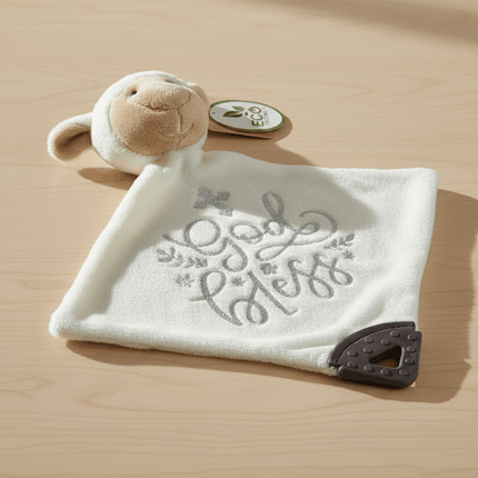 white lamb toy on table with God bless words