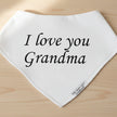 White bandana with 'I love you Grandma' text on a table background