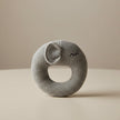 Gray knitted rattle toy on a table background