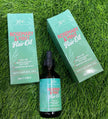 XHC Rosemary & Mint Hair Oil packaging on grass