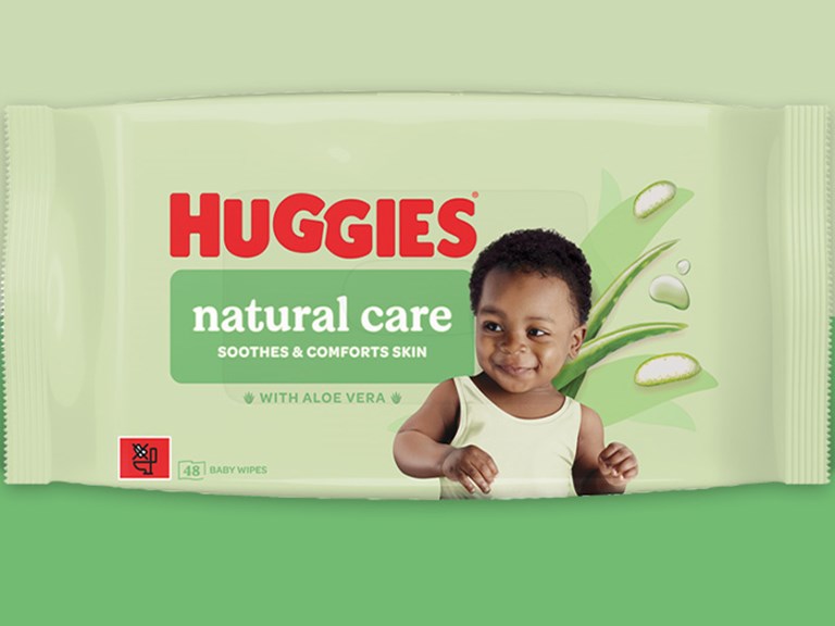 Huggies wipes packet against a greenbackground