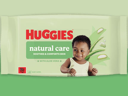 Huggies wipes packet against a greenbackground