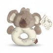 Plush elephant toy with a white ring on a white background