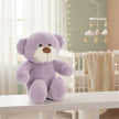 Plush lavender plush teddy bear in nursery