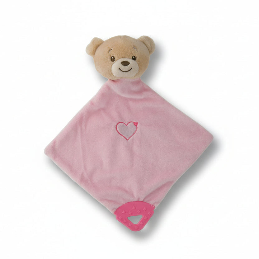 Pink plush blanket with a teddy bear face and heart design on a white background