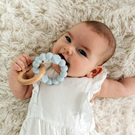 baby holding Jellystone Silicone & Wood Baby Teether