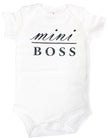 White baby onesie with 'mini BOSS' text on a white background