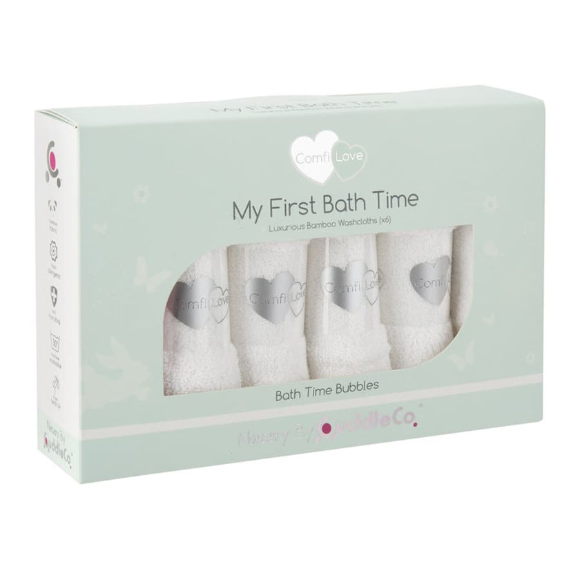 Light green box of white baby face cloths. My first bath time on the box